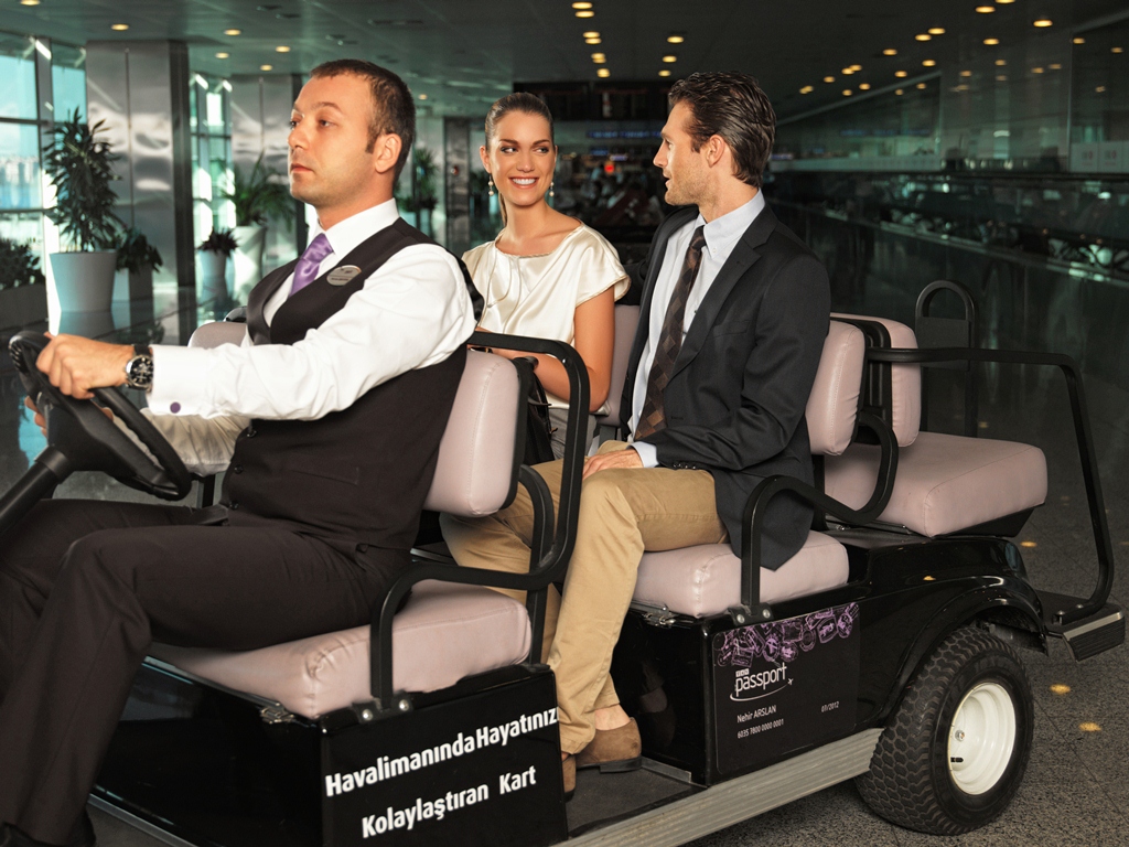 VIP passengers enjoying a chauffeured electric buggy transfer inside the Istanbul Airport terminal as part of a premium meet and greet service.