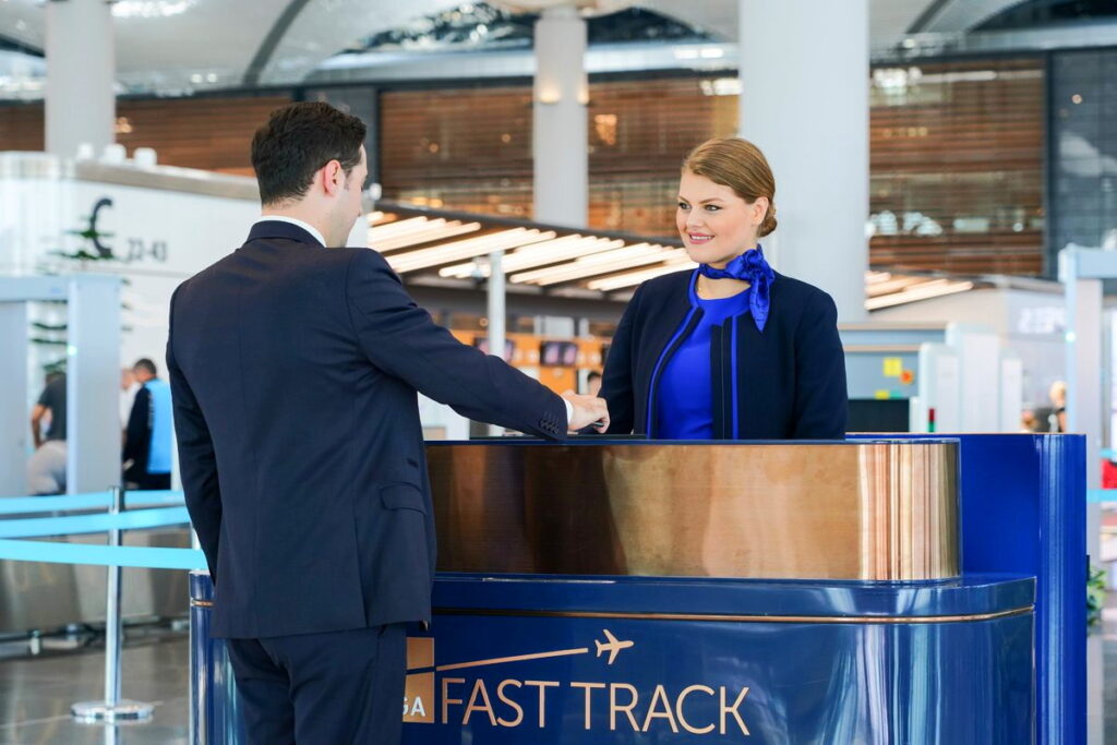 A passenger using the dedicated Fast Track lane at Istanbul Airport to bypass queues at security and passport control.