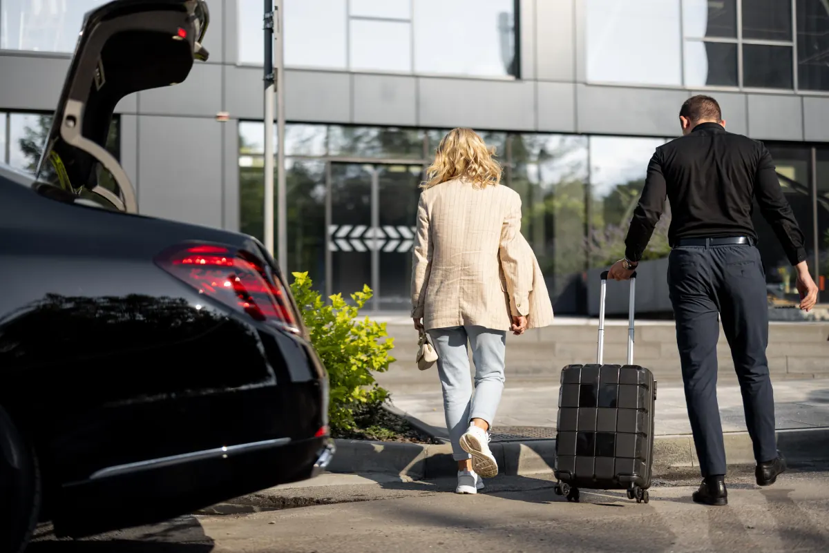 Chauffeur assisting a traveller with luggage at Istanbul Airport