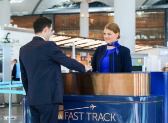 A passenger using the dedicated Fast Track lane at Istanbul Airport to bypass queues at security and passport control.